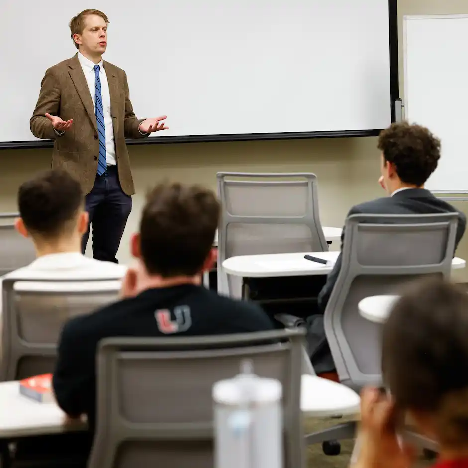 Post-doctoral associate Timothy Brennan speaking to a class